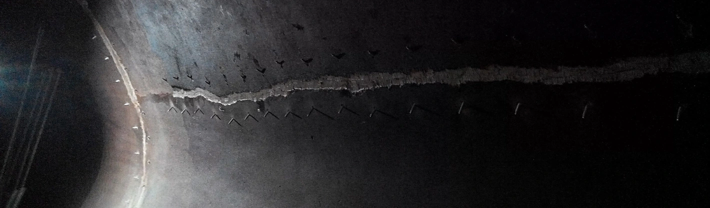 Sealing cracks in potable water structures